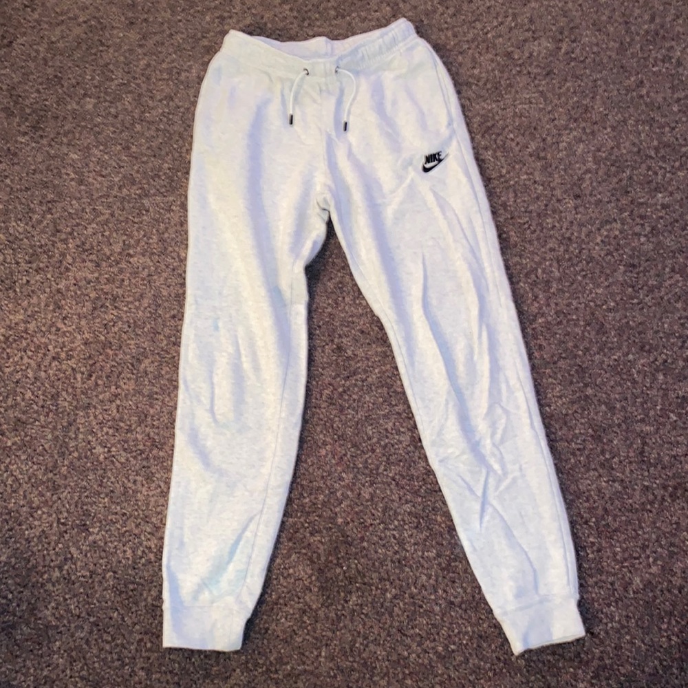 White woman’s Nike sweatpants